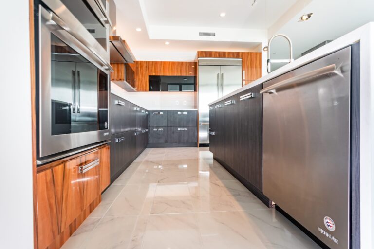 Kitchen with white walls and orange cabinets