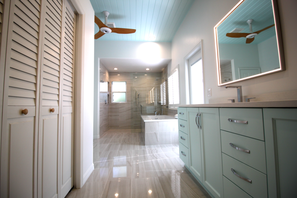 Coastal bathroom with gray tile and walk in shower