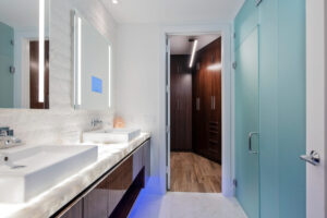 Illuminated countertop and mirrors in bathroom