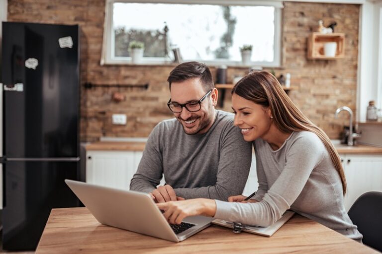 Man and woman looking at laptop