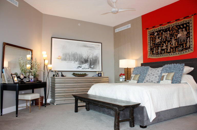 Bedroom with red wall over bed