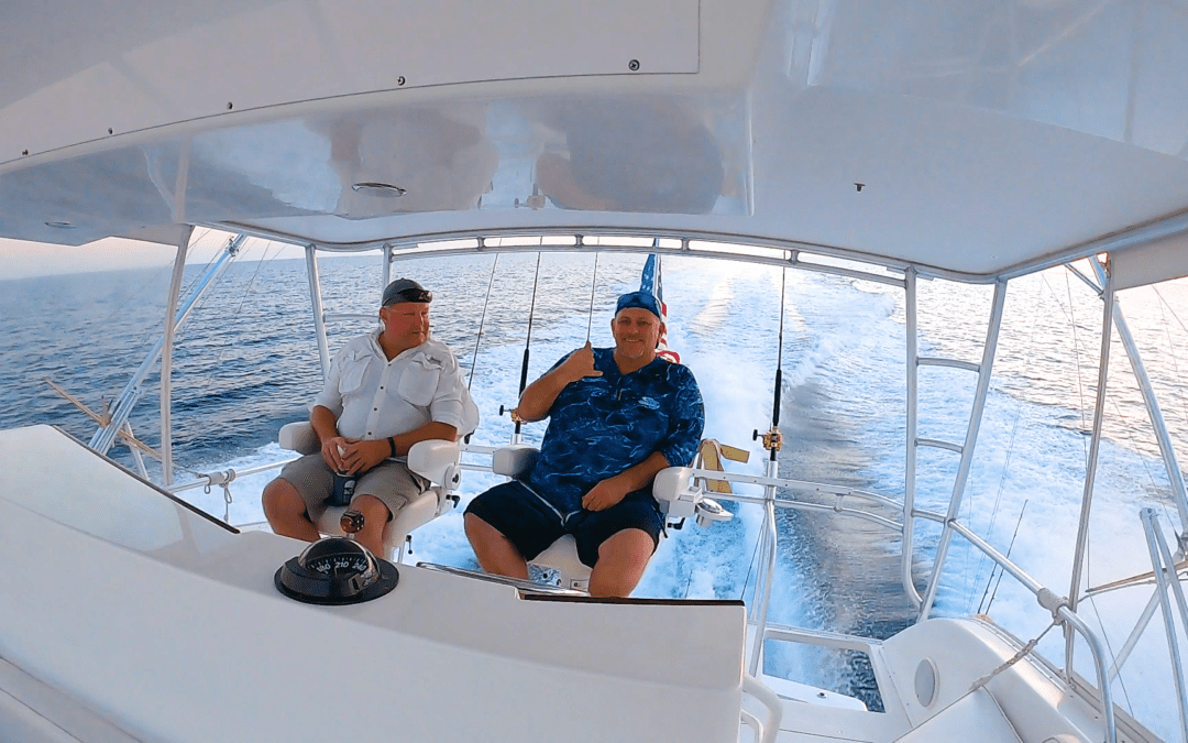 Two men sitting on yacht