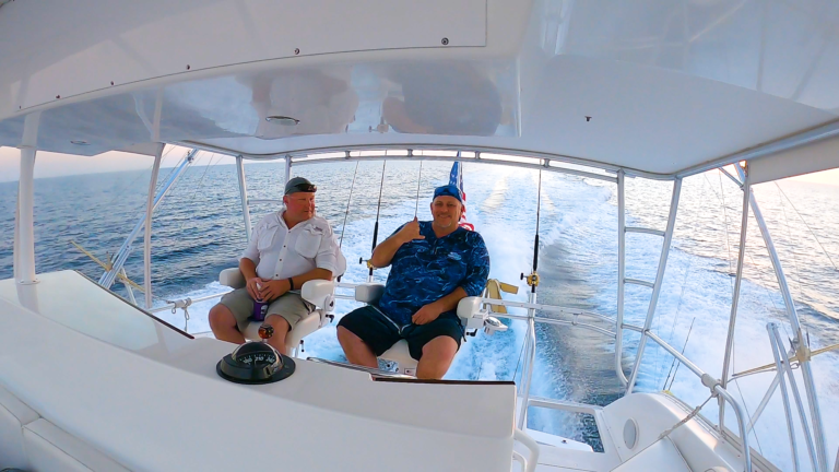 Two men sitting on yacht