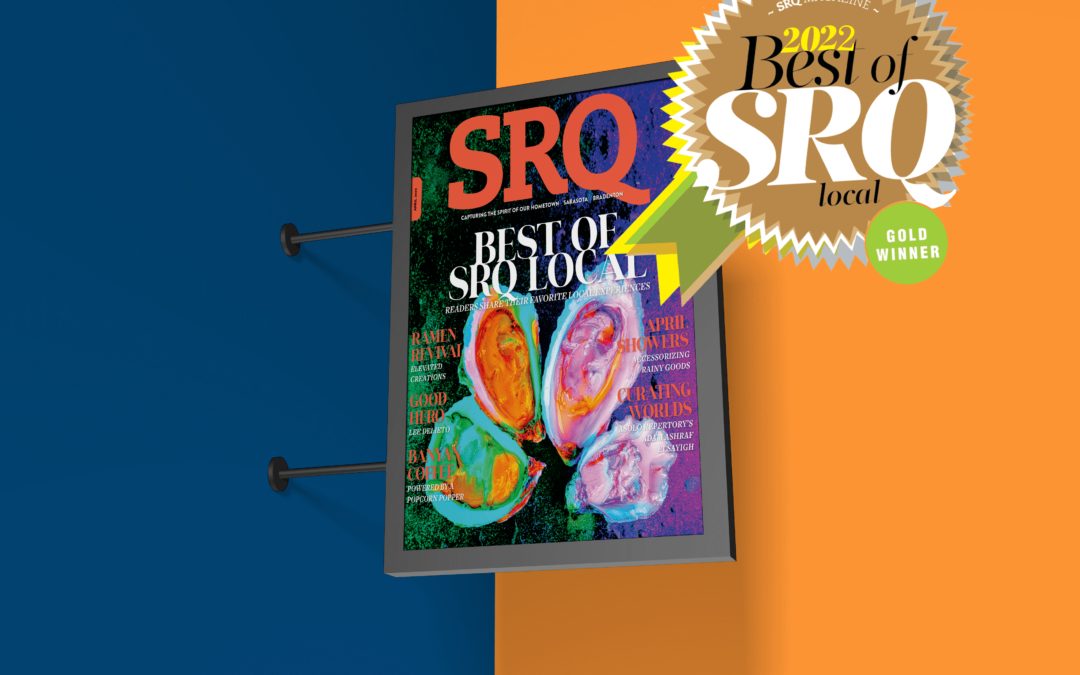 Magazine poster on orange and blue wall