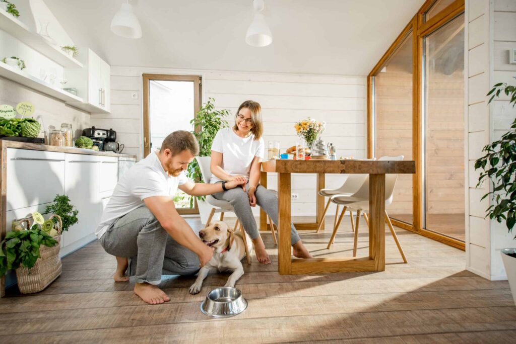 Couple playing with dog