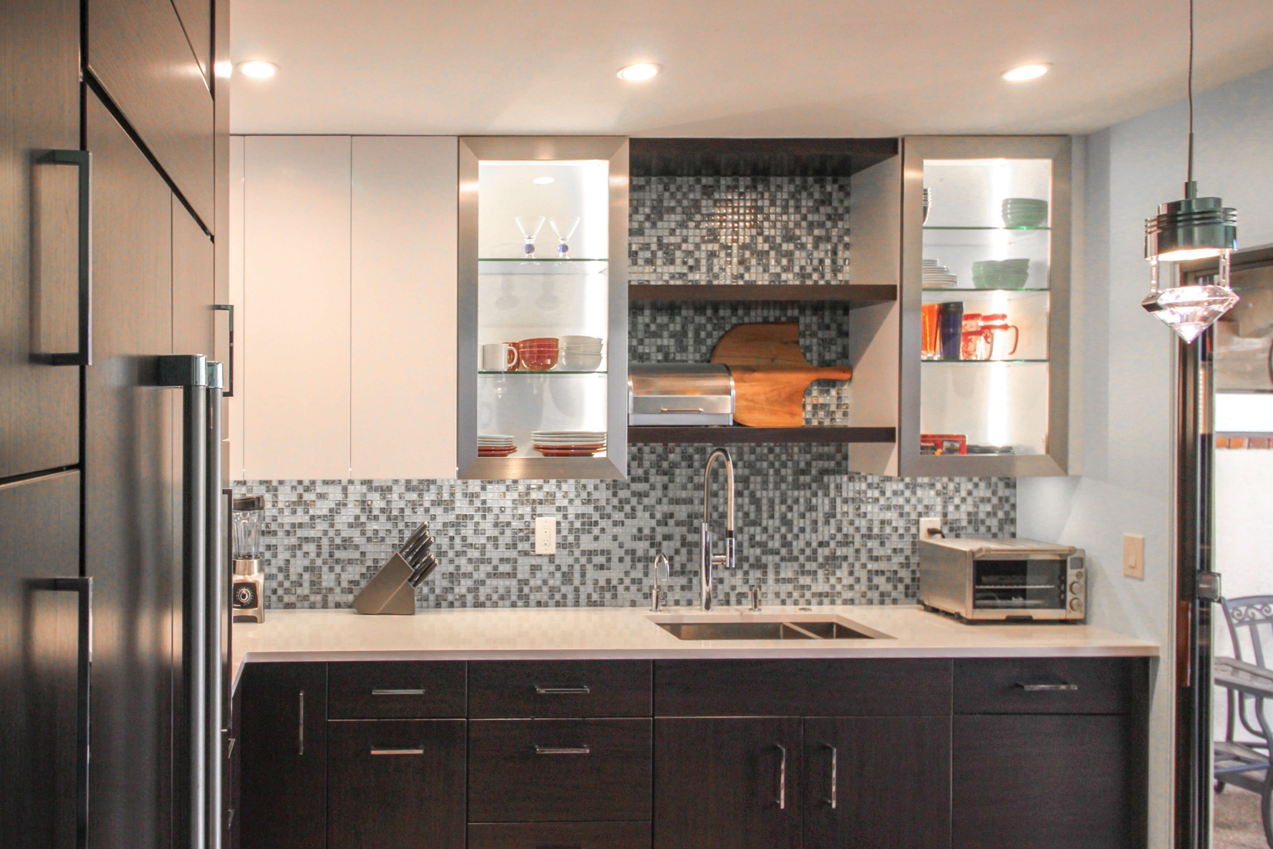 Brown cabinetry with floating shelves