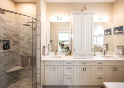Small bathroom with corner shower and floating vanity