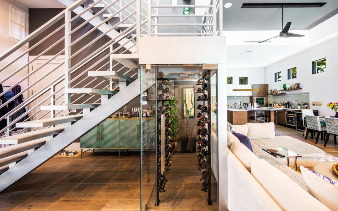 glass wine vault under staircase