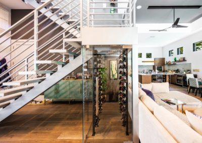 glass wine vault under staircase