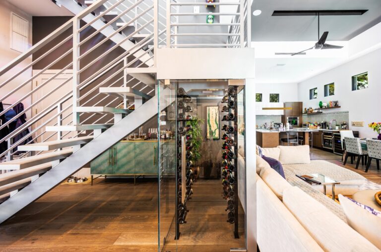 glass wine vault under staircase