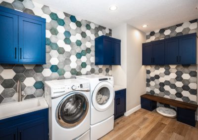 Blue hexagon tile on laundry room wall
