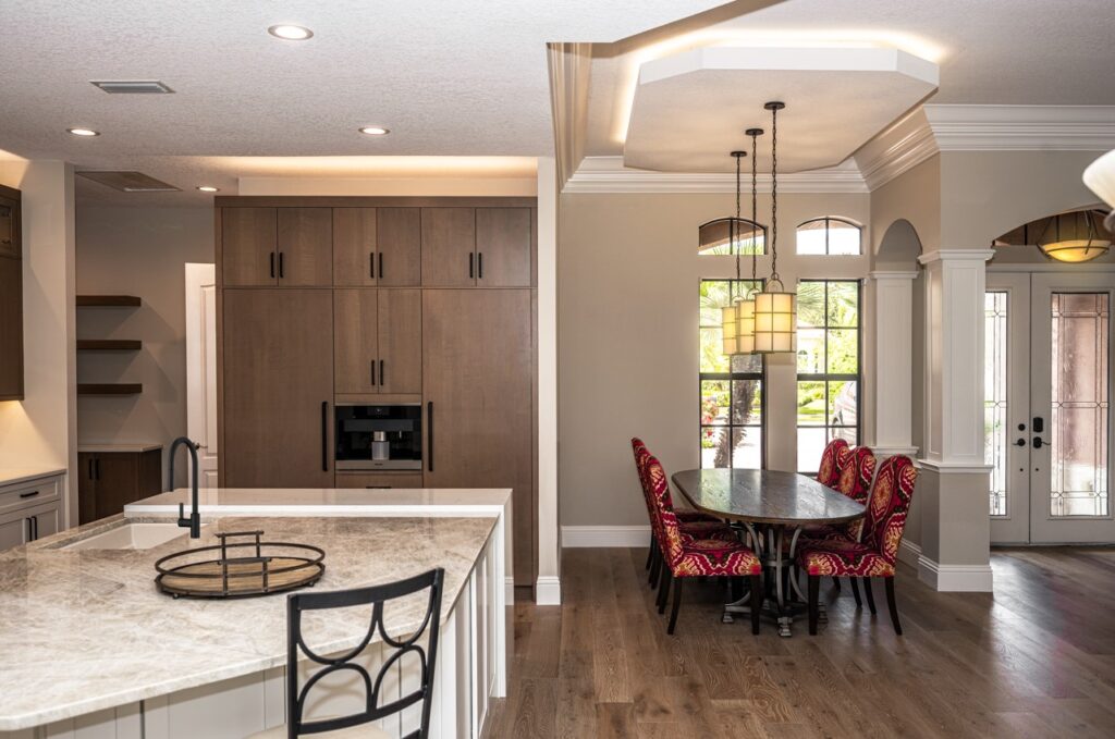 Dining room next to kitchen with brown pantry