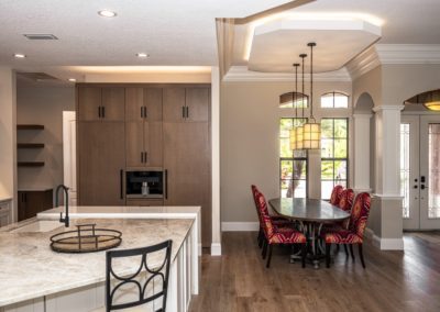 Dining room next to kitchen with brown pantry