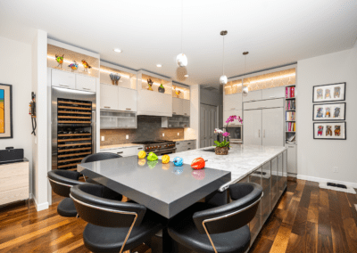 Kitchen with island and backlit cabinets