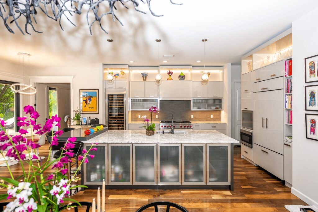 Kitchen with island and backlit cabinets