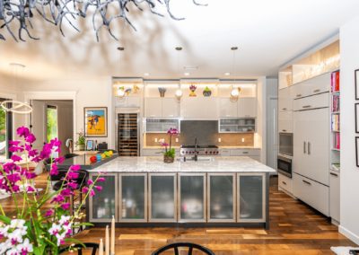 Kitchen with island and backlit cabinets