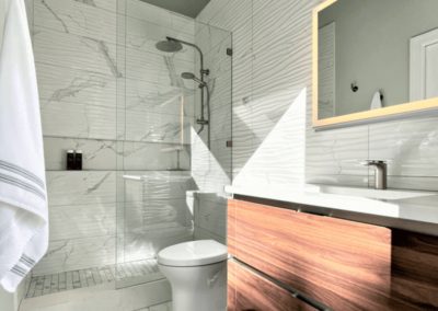 Shower with textured white wall tile