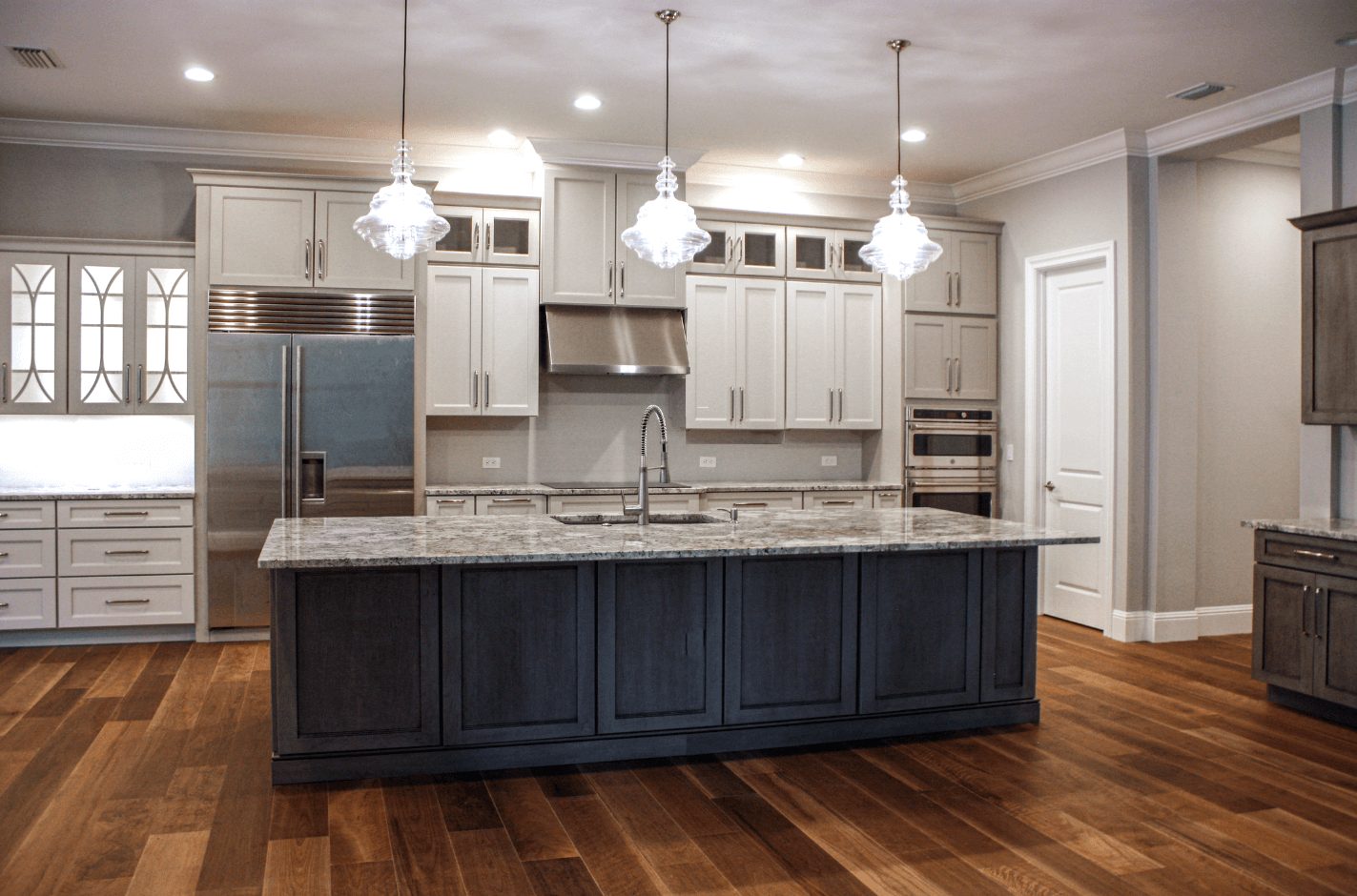 White cabinets and granite countertop in kitchen