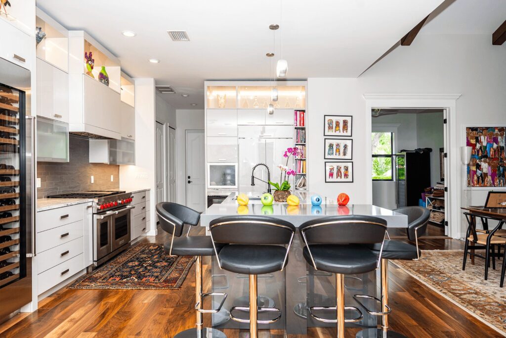 Kitchen with island and backlit cabinets