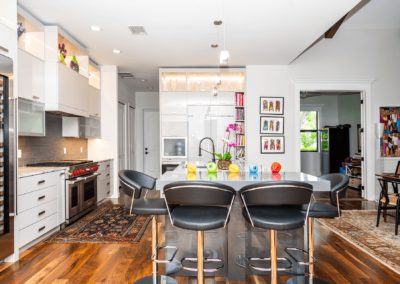 Kitchen with island and backlit cabinets