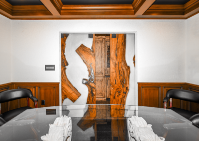 Partially open wood door to conference room