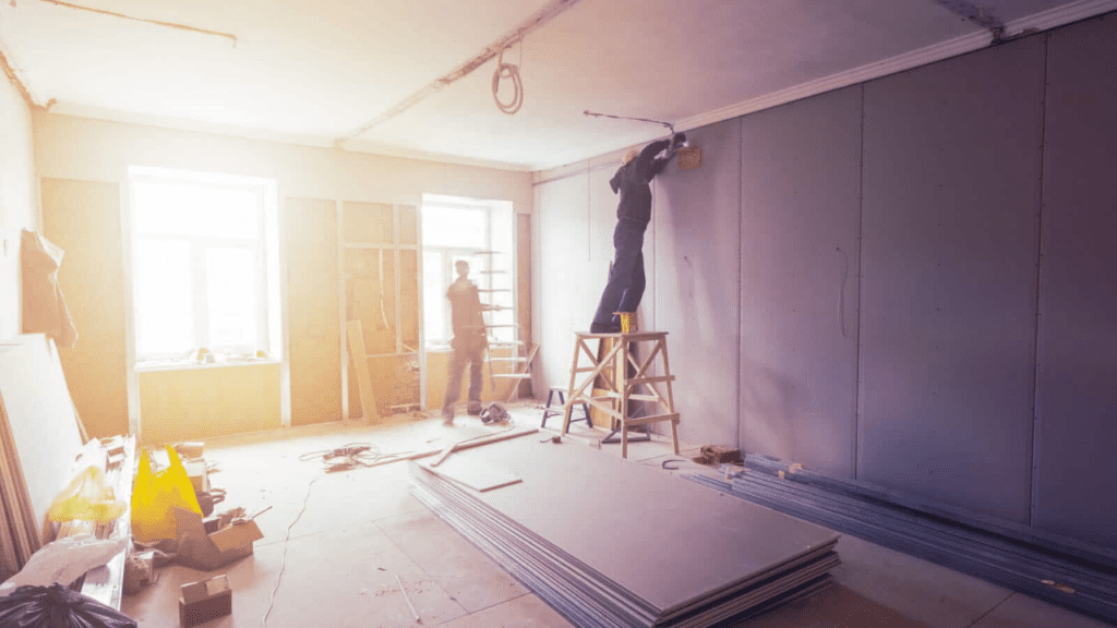 Workers are installing plasterboard