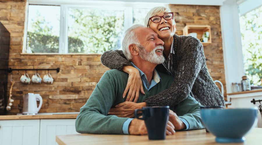 mature woman hugging her husband
